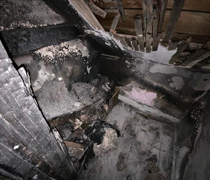 A picture of an electrical fire in a closet